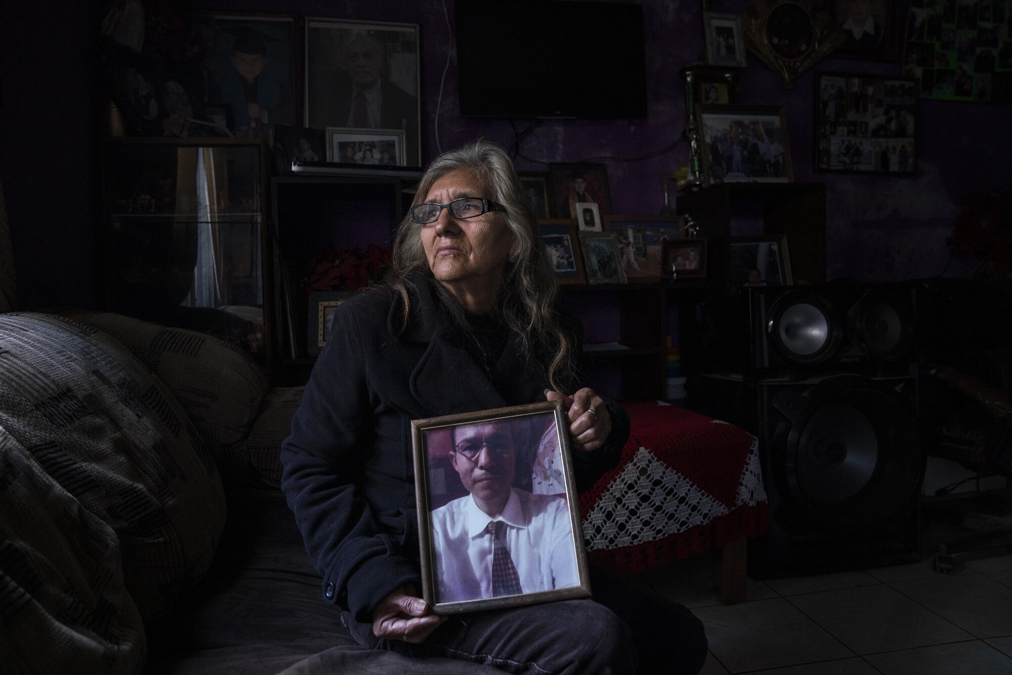 Guadalupe Aragón Sosa holds a photo of her son Carlos
