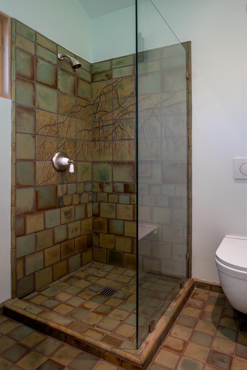 A bathroom with Arts and Crafts tiles 