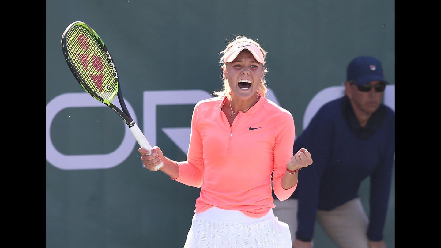 Sofya Zhuk of Russia reacts to winning a big point in her semi-final match against Mayo Hibi in the Oracle Challenger Series tennis tournament at the Newport Beach Tennis Club on Saturday.