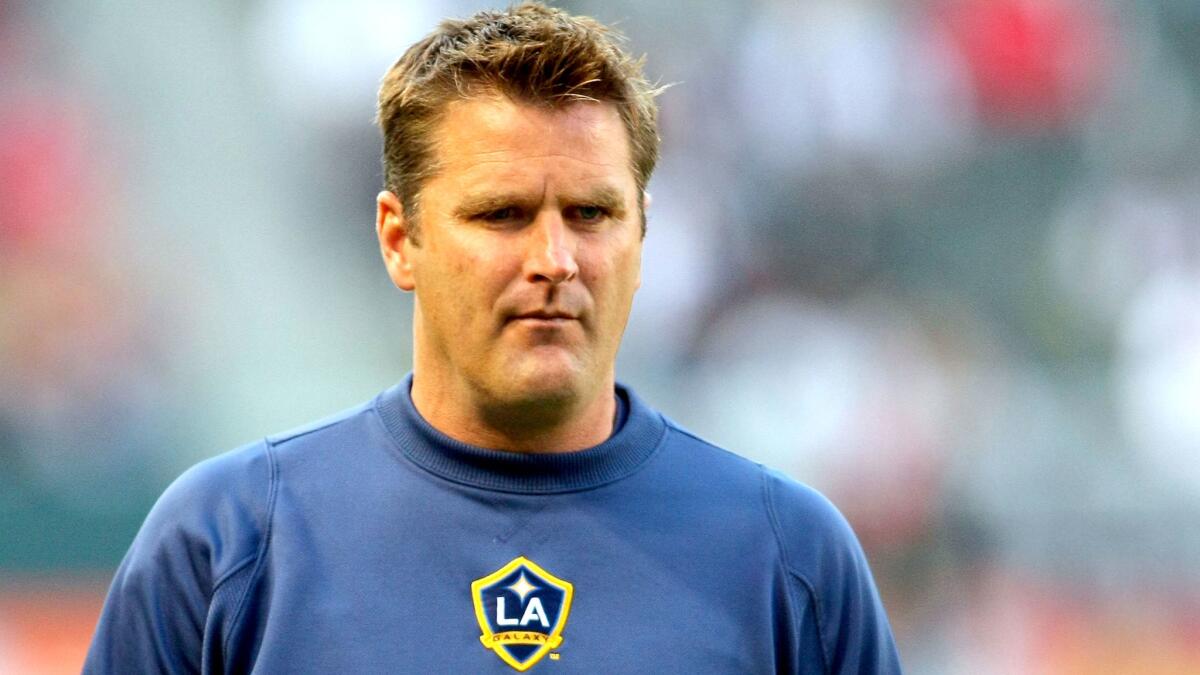 The Galaxy have fired coach Curt Onalfo and hired former Galaxy player Sigi Schmid to take his place.