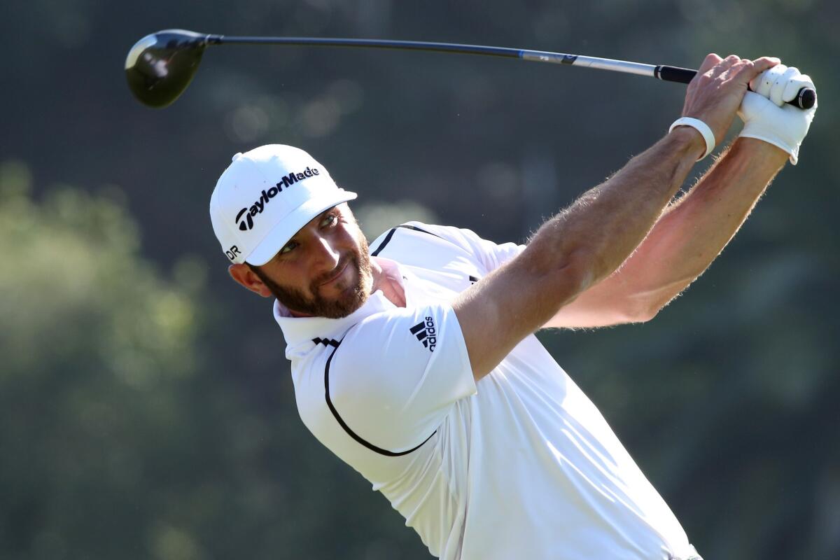 Dustin Johnson watches his shot during the first round of the Northern Trust Open at the Riviera Country Club in Pacific Palisades on Feb. 13, 2014.