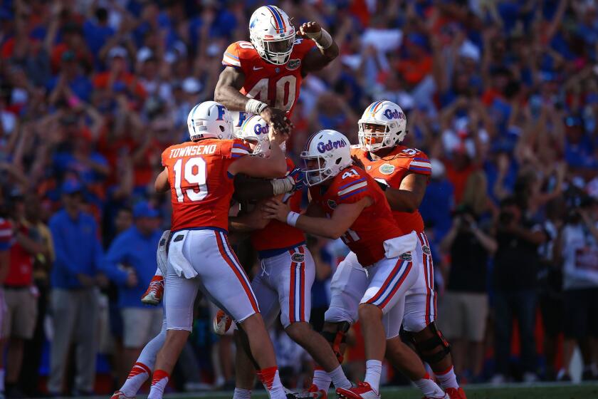 Florida Gators players celebrate with Austin Hardin (center) after he made the game-winning field goal during the fourth quarter of the game against Vanderbilt on Nov. 7.