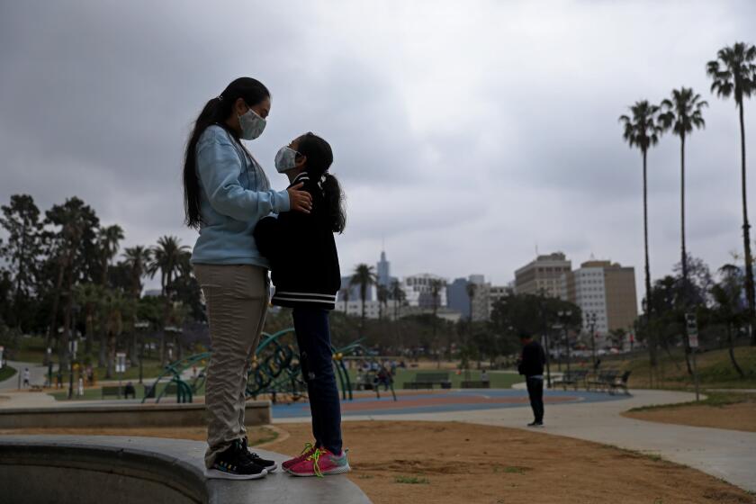 Ambar, 28, and her ten-year-old daughter, from Venezuela, at MacArthur Park on Tuesday, June 20, 2023 in Los Angeles.