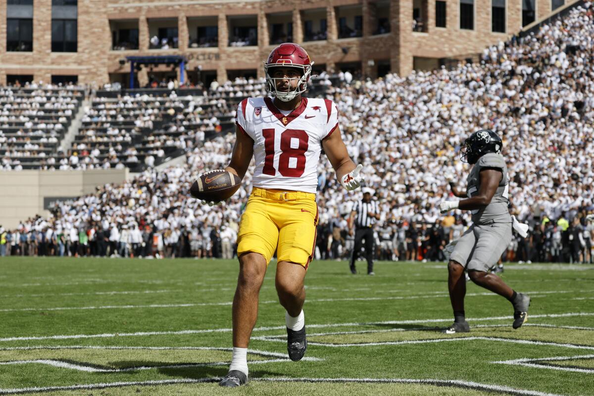 USC tight end Jude Wolfe scores against Colorado in the third quarter Saturday.