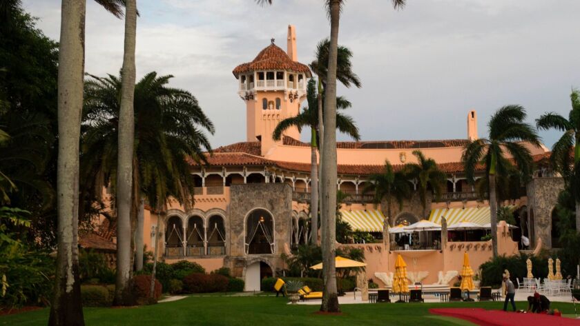Workers lay out a red carpet at Mar-a-Lago Club in Palm Beach, Fla. President Trump has used H-2B visas to hire temporary foreign workers at his resorts in the state.