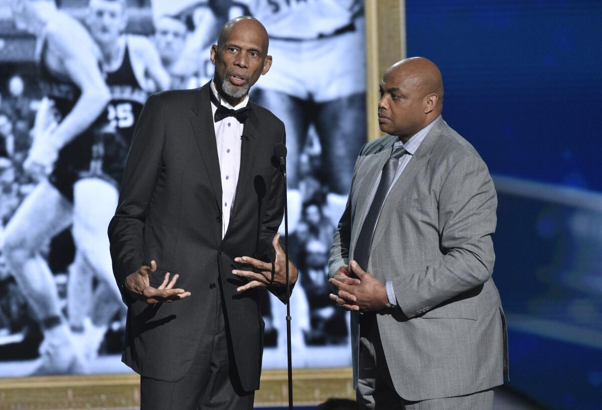 Charles Barkley, right, joins Kareem Abdul-Jabbar on stage at the NBA Awards show in 2018.