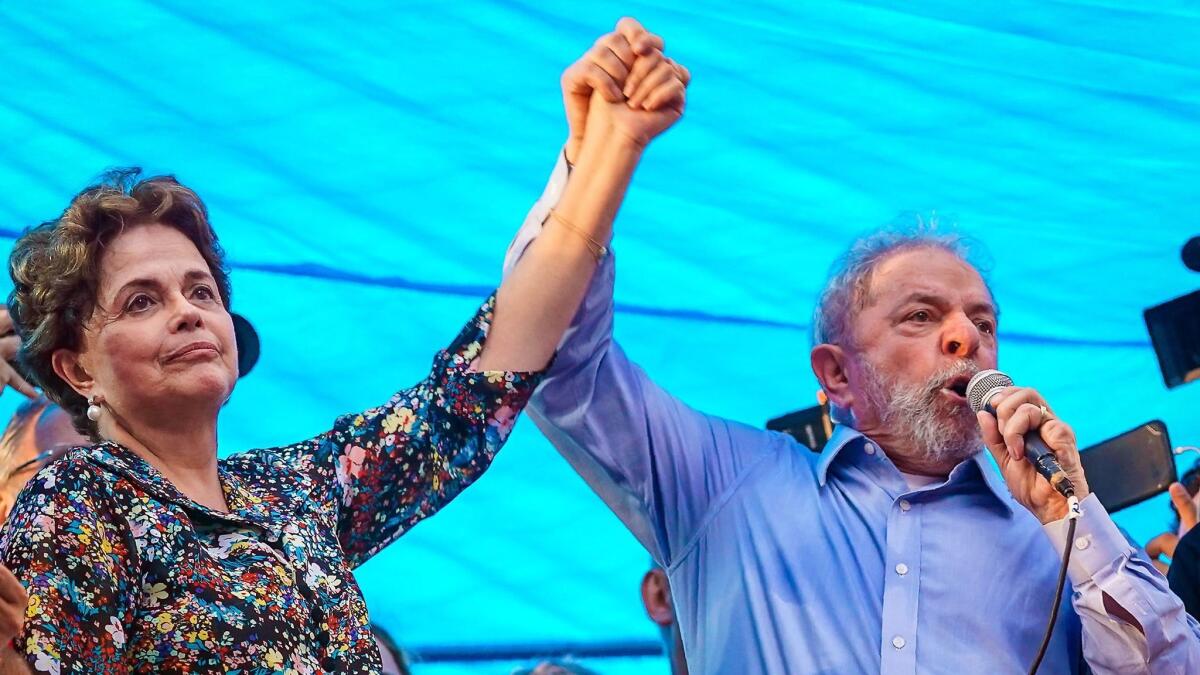 Former Presidents Dilma Rousseff and Luiz Inacio Lula da Silva greet supporters in Porto Alegre, Brazil, on Jan. 23, 2018. Rousseff was impeached and Lula was convicted of corruption.