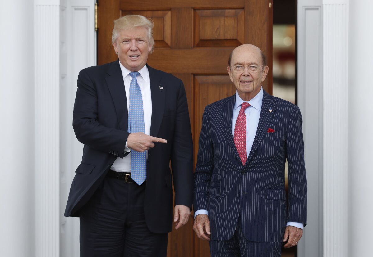 President-elect Donald Trump, left, with Commerce secretary pick Wilbur Ross, whose estimated worth is $2.5 billion.