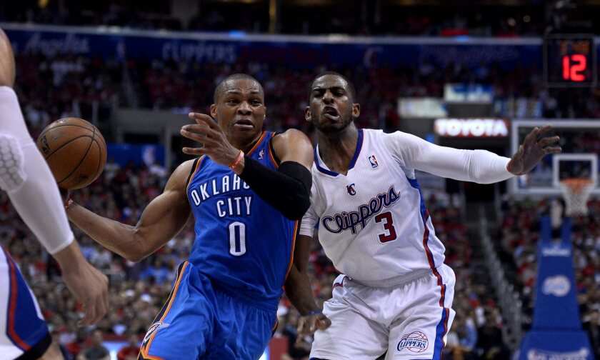 Oklahoma City's Russell Westbrook, left, drives past Chris Paul during Game 2 of the Clippers-Thunder playoff series.