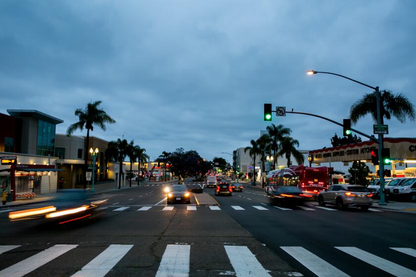 Cars drive down El Cajon Boulevard in the Normal Heights neighborhood of San Diego on June 2, 2019 in San Diego, California. There were 32 violent crimes reported in this Normal Heights/Kensington census block group between 2014 and 2018, more than half of which occurred on El Cajon Boulevard