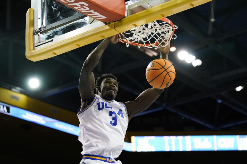 UCLA forward Adem Bona dunks the ball during an exhibition game 