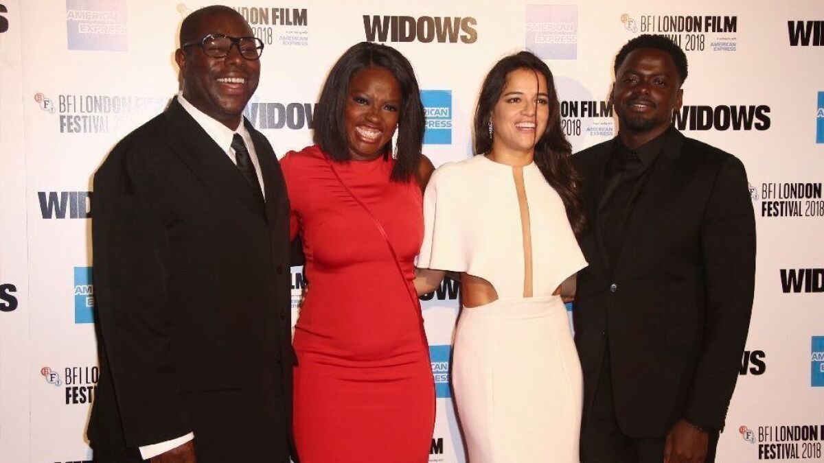 Director Steve McQueen, from left, and actors Viola Davis, Michelle Rodriguez and Daniel Kaluuya arrive at the opening of the London Film Festival and the U.K. premiere of "Widows" on Oct. 10, 2018.