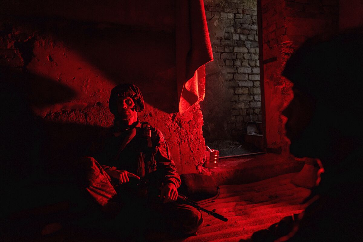 Ukrainian servicemen taking cover in a shelter