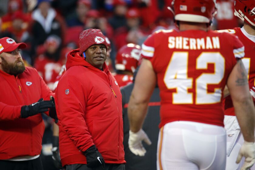 Kansas City Chiefs offensive coordinator Eric Bieniemy watches players before the AFC championship game.