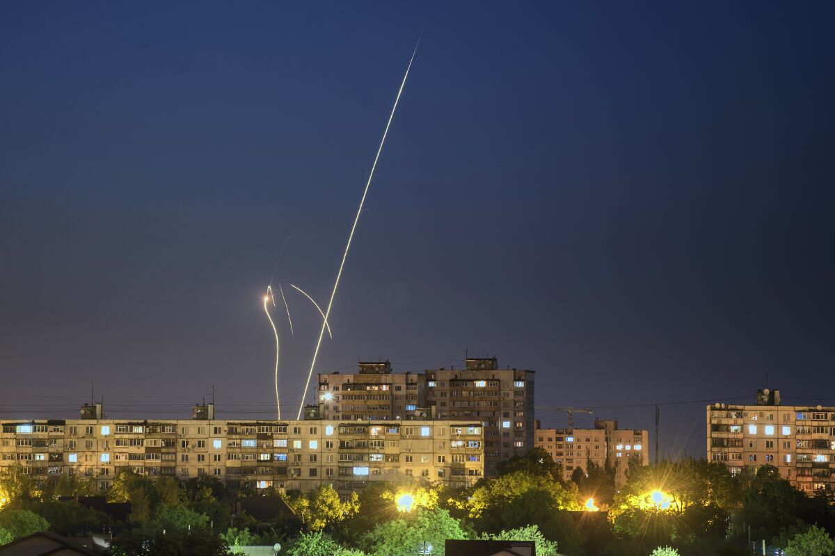 Russian rockets are launched against Ukraine from Russia's Belgorod region, seen from Kharkiv, Ukraine, late Sunday, June 4, 2023. (AP Photo/Vadim Belikov)