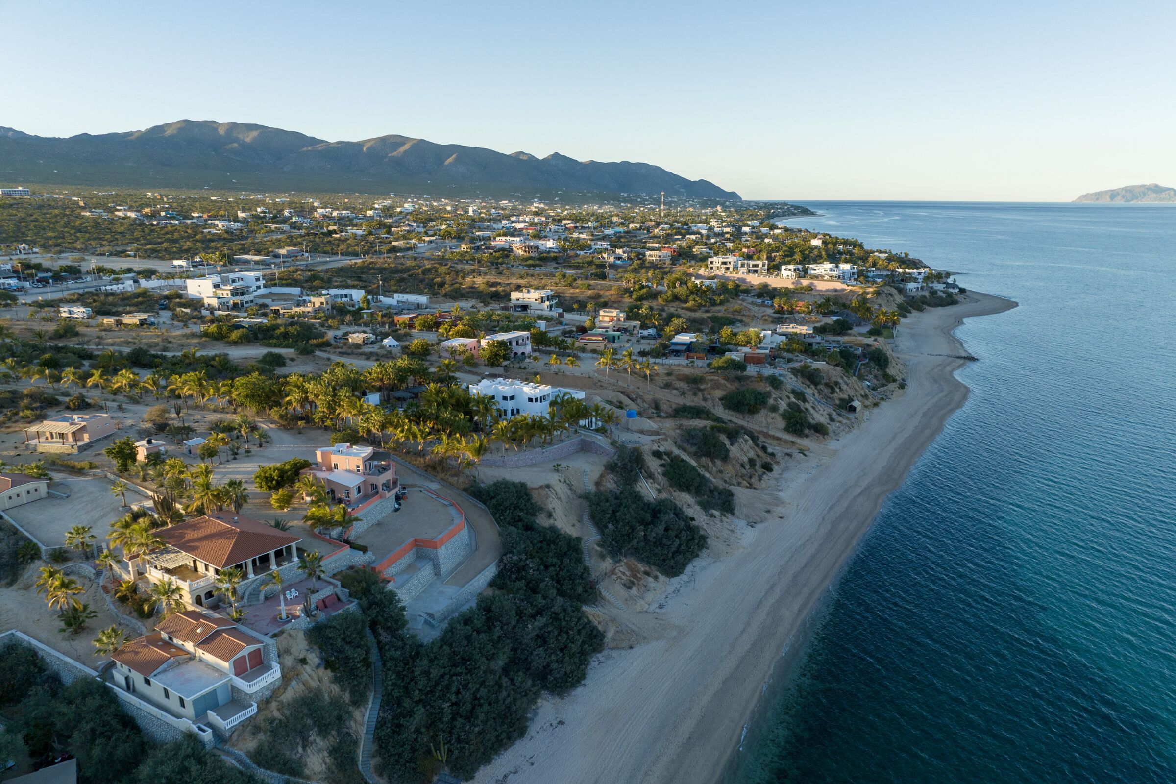 Luxury beachfront properties line the shore 