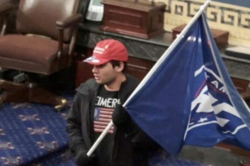 Christian Secor, was captured on video camera inside the Senate chambers, after the pro-Trump mob broke into the Capitol.