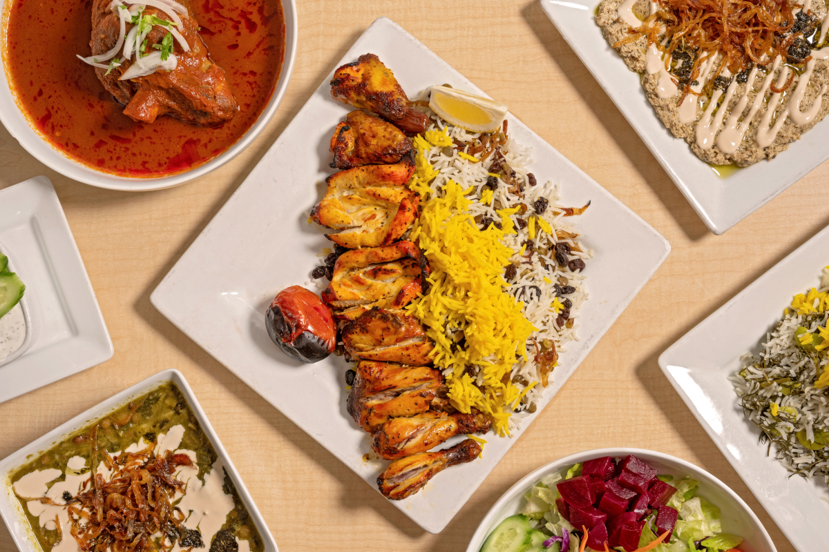 A spread of popular dishes including: Ash Reshteh soup, the Cornish Game Hen special., Lamb Shank and Roasted Eggplant Dip