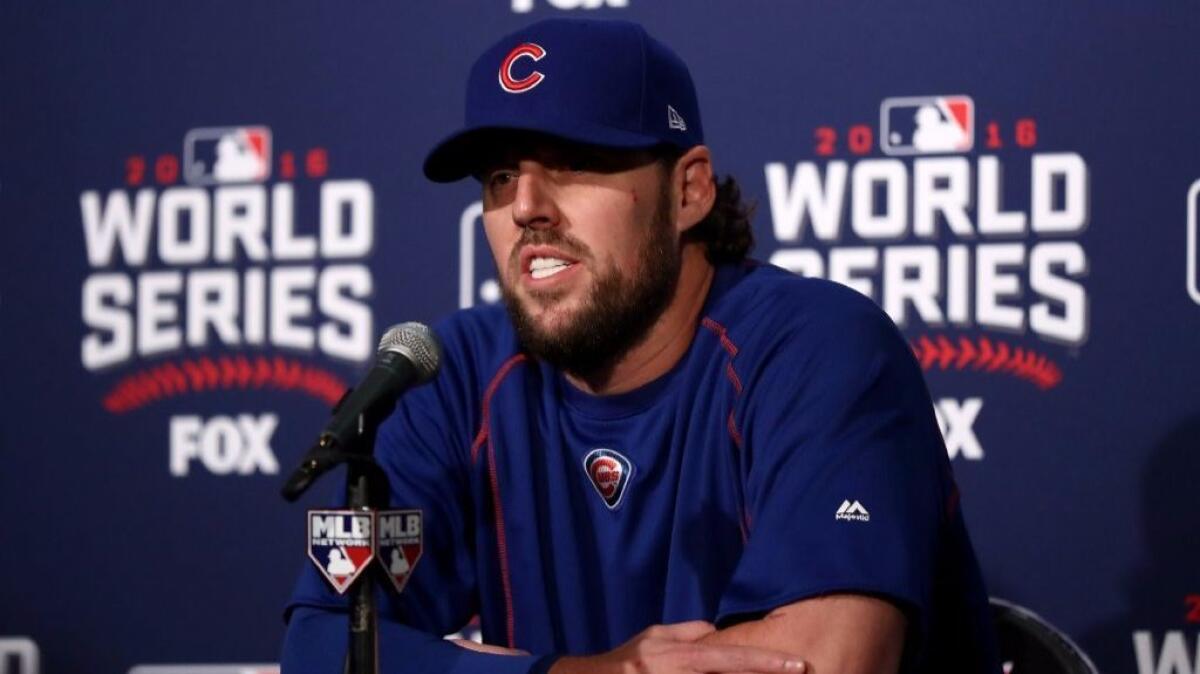 Cubs pitcher John Lackey, who has been in the big leagues for 14 years, fields media questions Friday before Game 3 of the World Series in Chicago.
