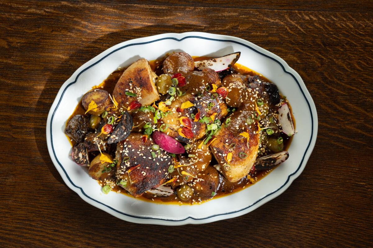 OAKLAND, CA - MAY 14: Pollo en chicha at Popoca in Oakland, CA on Wednesday, May 14, 2025. (Myung J. Chun / Los Angeles Times).