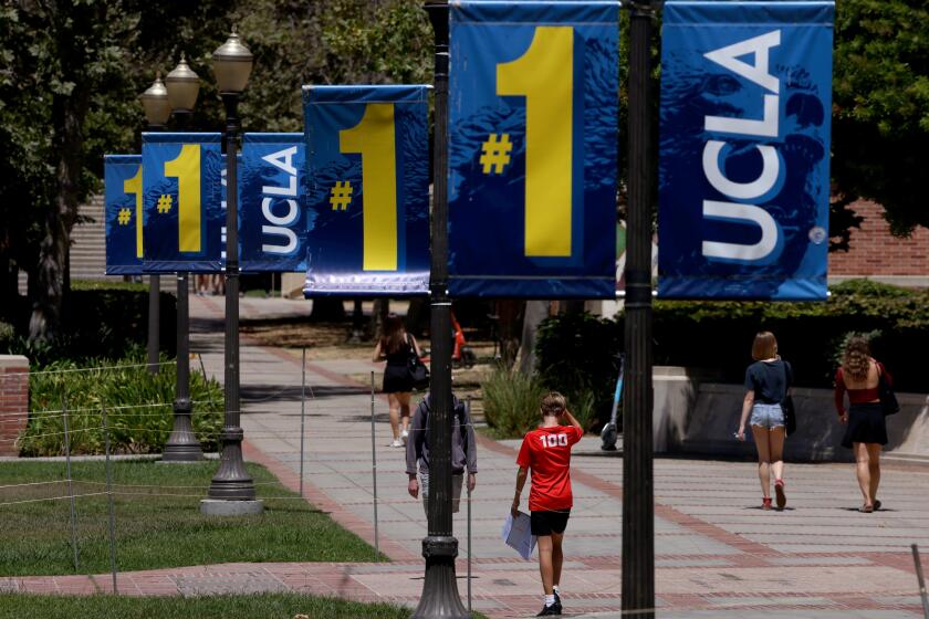 WESTWOOD, CA - AUGUST 15, 2024 - Students and visitors make their way on the UCLA campus in Westwood on August 15, 2024. (Genaro Molina/Los Angeles Times)