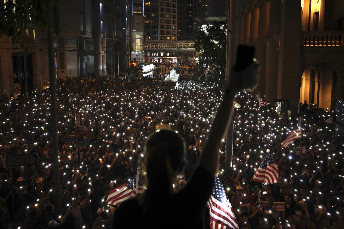 Protesters light torches at a peaceful rally in central Hong Kong on Oct. 14, 2019.