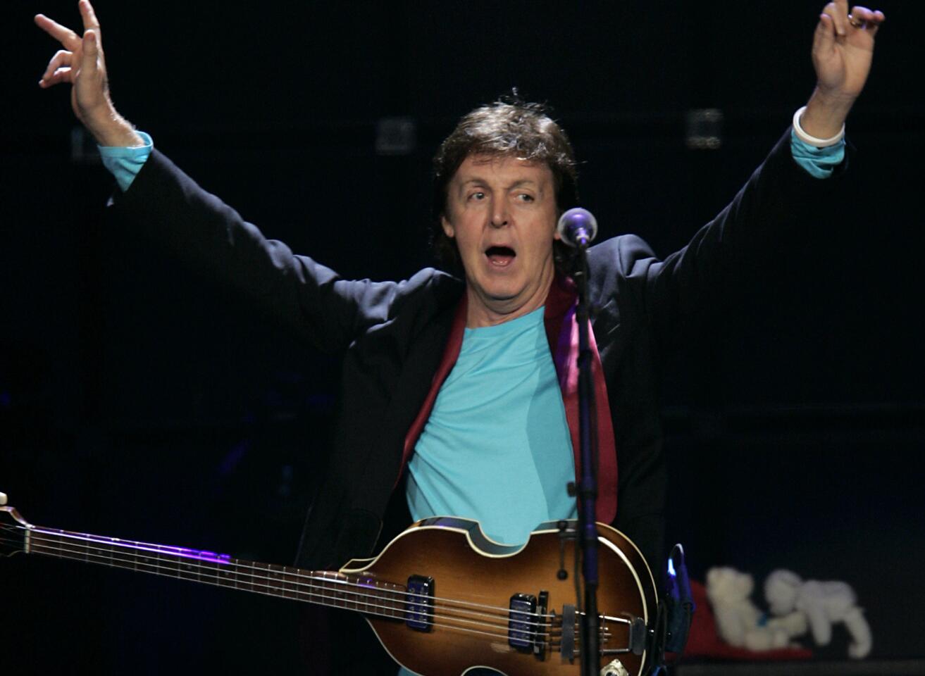 Paul McCartney is one of the bestselling and most-honored musicians of all time. Take a look back at McCartney's storied career. Pictured: McCartney performing in Anaheim, Calif. on November 11, 2005.