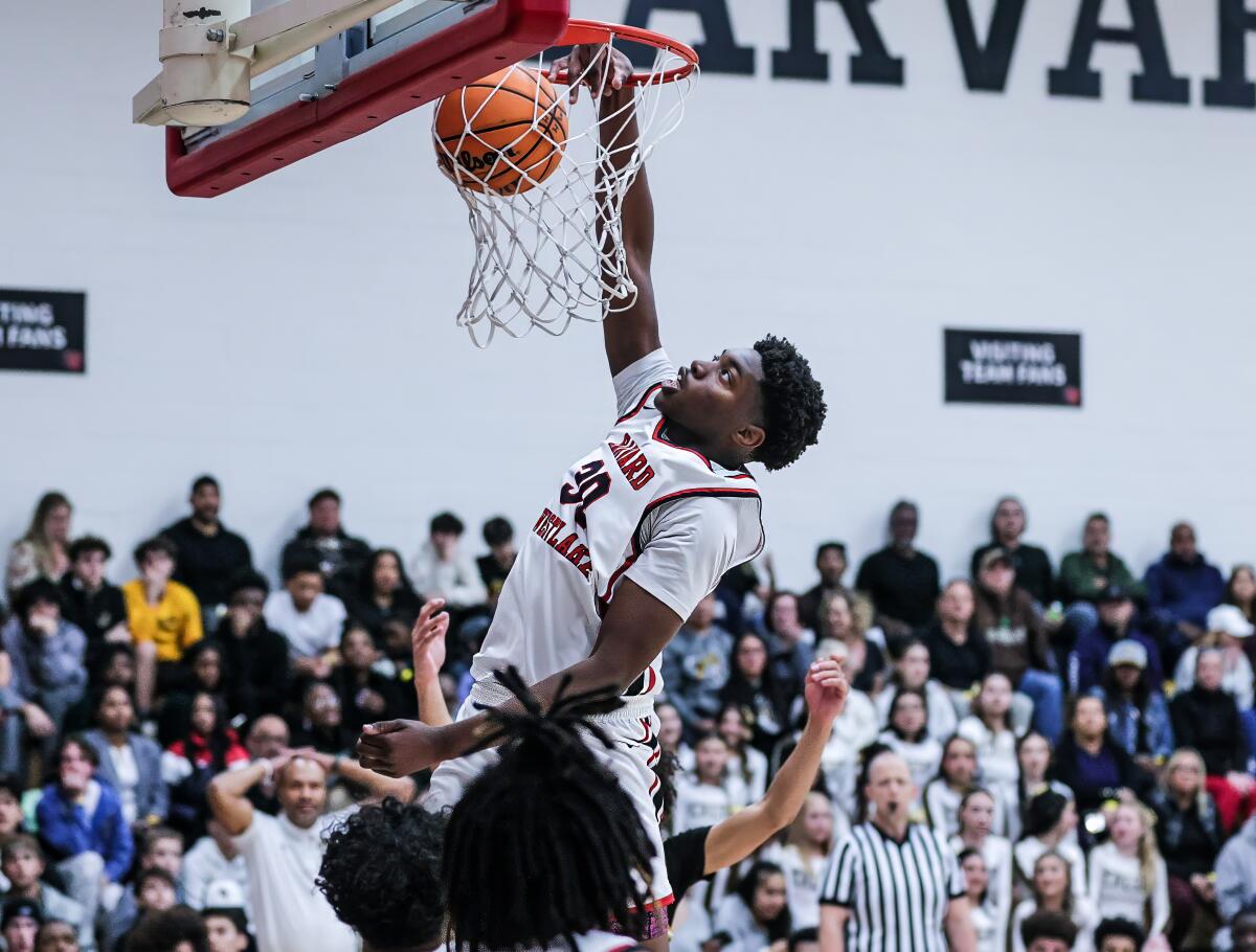 Dominique Bentho throws down a dunk.