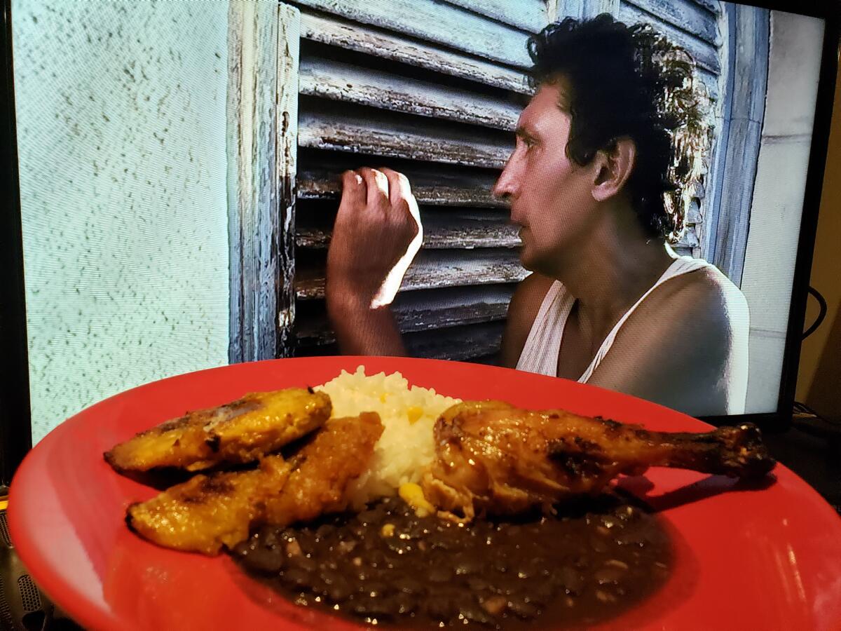 Alexis Díaz de Villegas as Juan in "Juan de los Muertos" (Juan of the Dead) — with roasted chicken and rice and beans.