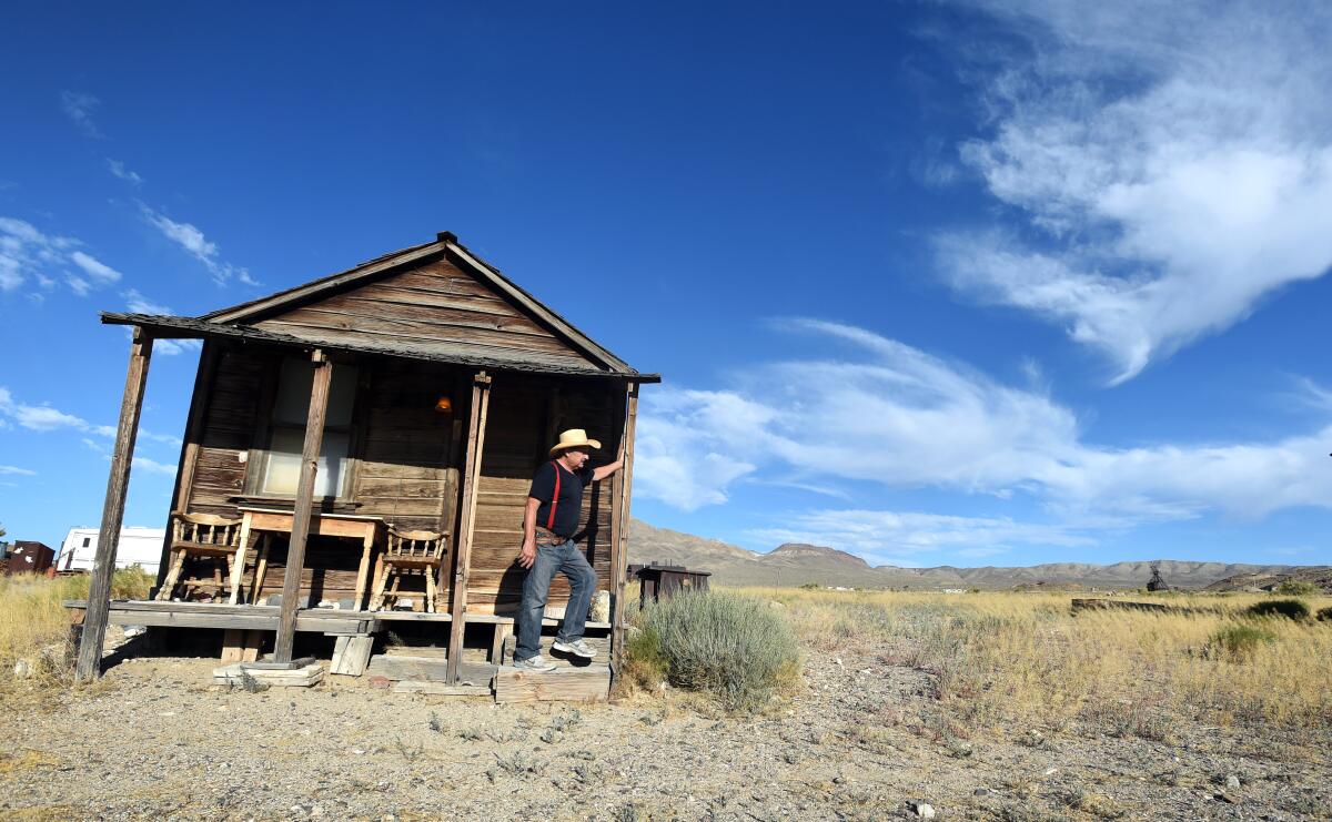 Proprietor Walt Kremin stands among his historic buildings in Gold Point, Nev.
