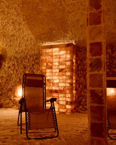 Valley Salt Cave's community room with a zero-gravity chair.