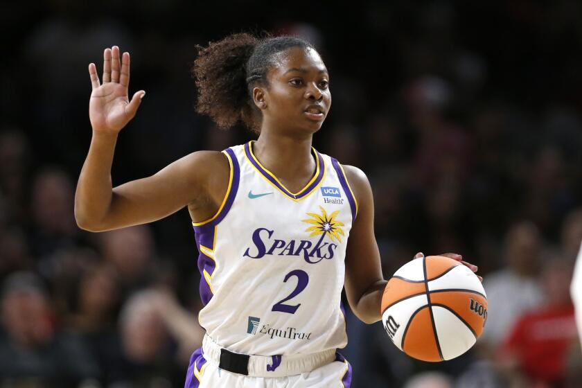 LAS VEGAS, NEVADA - MAY 27: Nia Clouden #2 of the Los Angeles Sparks takes the ball upcourt during the second quarter.