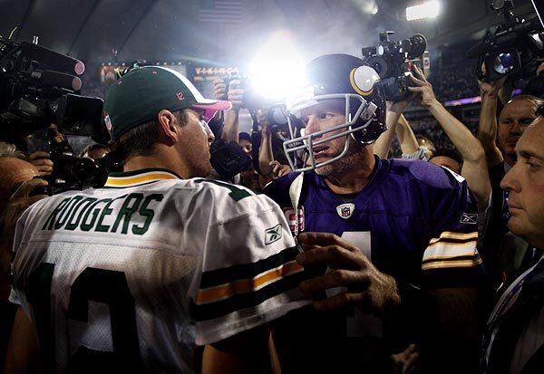 Vikings quarterback Brett Favre shakes hands with Packers quarterback Aaron Rodgers after the Minnesota's win against Green Bay on Monday night. Favre won a Super Bowl and set several records in his 15 seasons with the Packers.