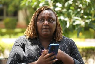 Njeri Migwi, a woman human rights defender and the Co-Founder of Usikimye (Swahili word for 'Don't be Silent'), an organization working towards ending the prevalence of sexual and gender-based violence (GBV) holds her phone in downtown Nairobi, Kenya, Wednesday, March 6, 2024. Migwi, is on the frontline of a war against a silent epidemic of Gender Based Violence or GBV in Kenya that also afflicts many Sub-Saharan African countries, with devasting consequences on individuals, societies and even the countries’ economies. (AP Photo/Brian Inganga)