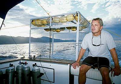 Pete Thomas sits on the deck before diving with Humboldt squid in the Sea of Cortes.