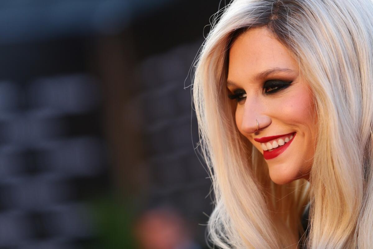 Kesha has postponed tour dates to continue treatment for an eating disorder. "I look forward to coming back stronger than ever on the next tour," she says in a statement.