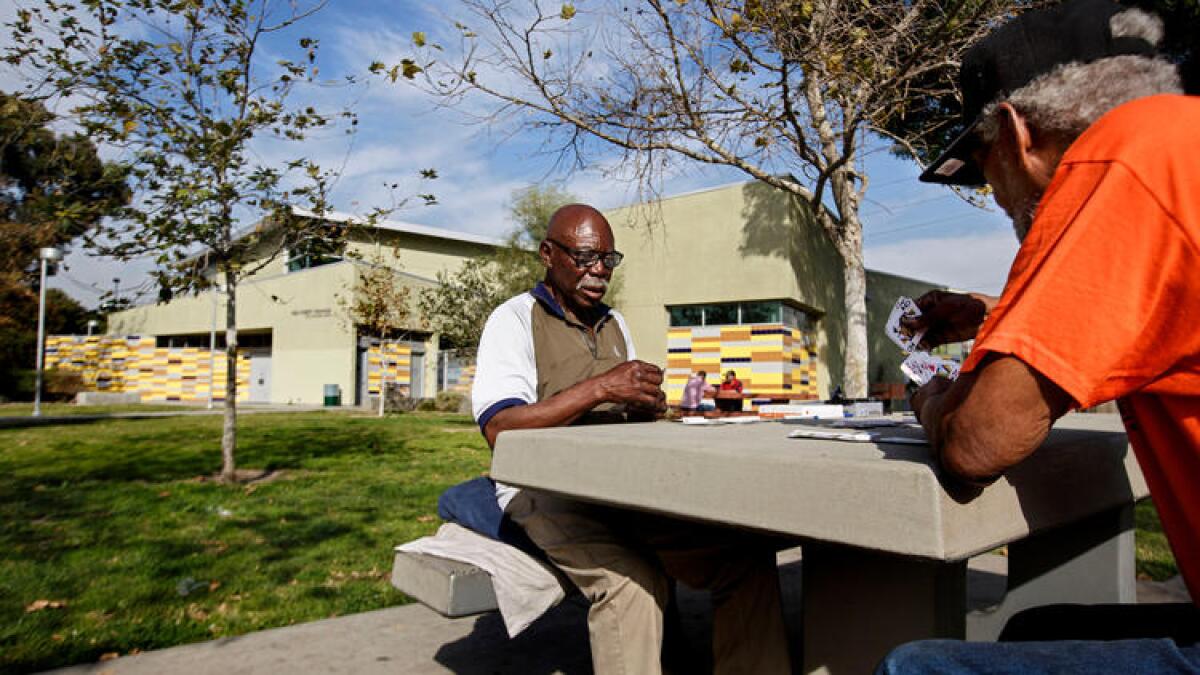 Men play pinochle at Fred Roberts Recreation Center in South Los Angeles, an area that is among the most park-poor parts of L.A. County.