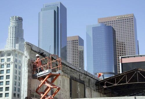 THE OLD THEATER: Against a backdrop of some of downtown L.A.s tallest buildings, workers dismantle the Linda Lea, once one of the nations top exhibitors of Japanese movies.