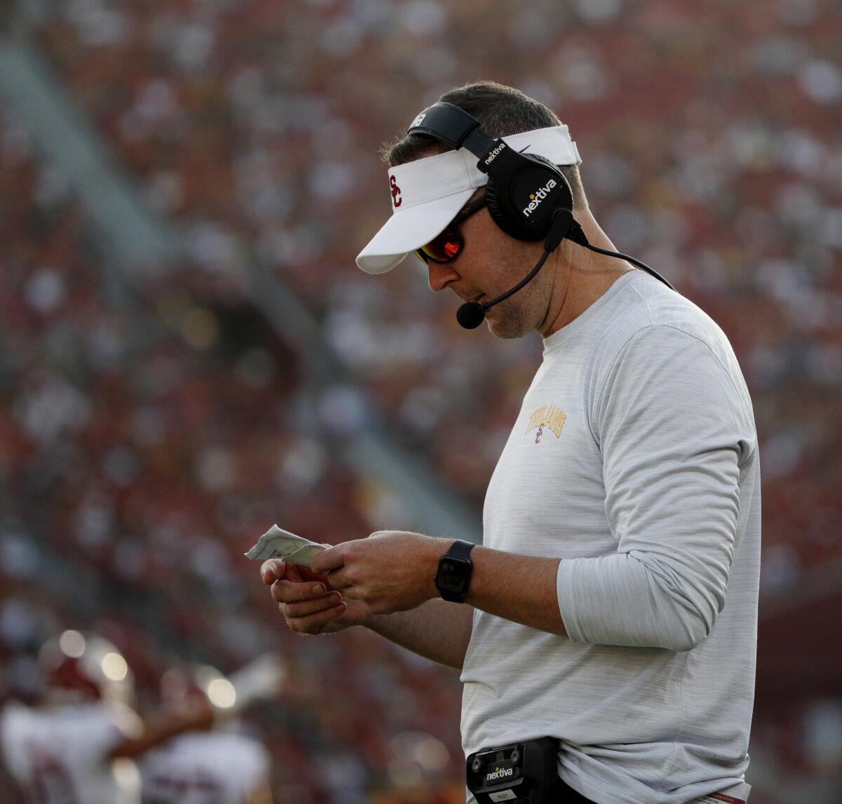 Trojans coach Lincoln Riley looks at a play sheet against Washington State in the first half Oct. 8, 2022.