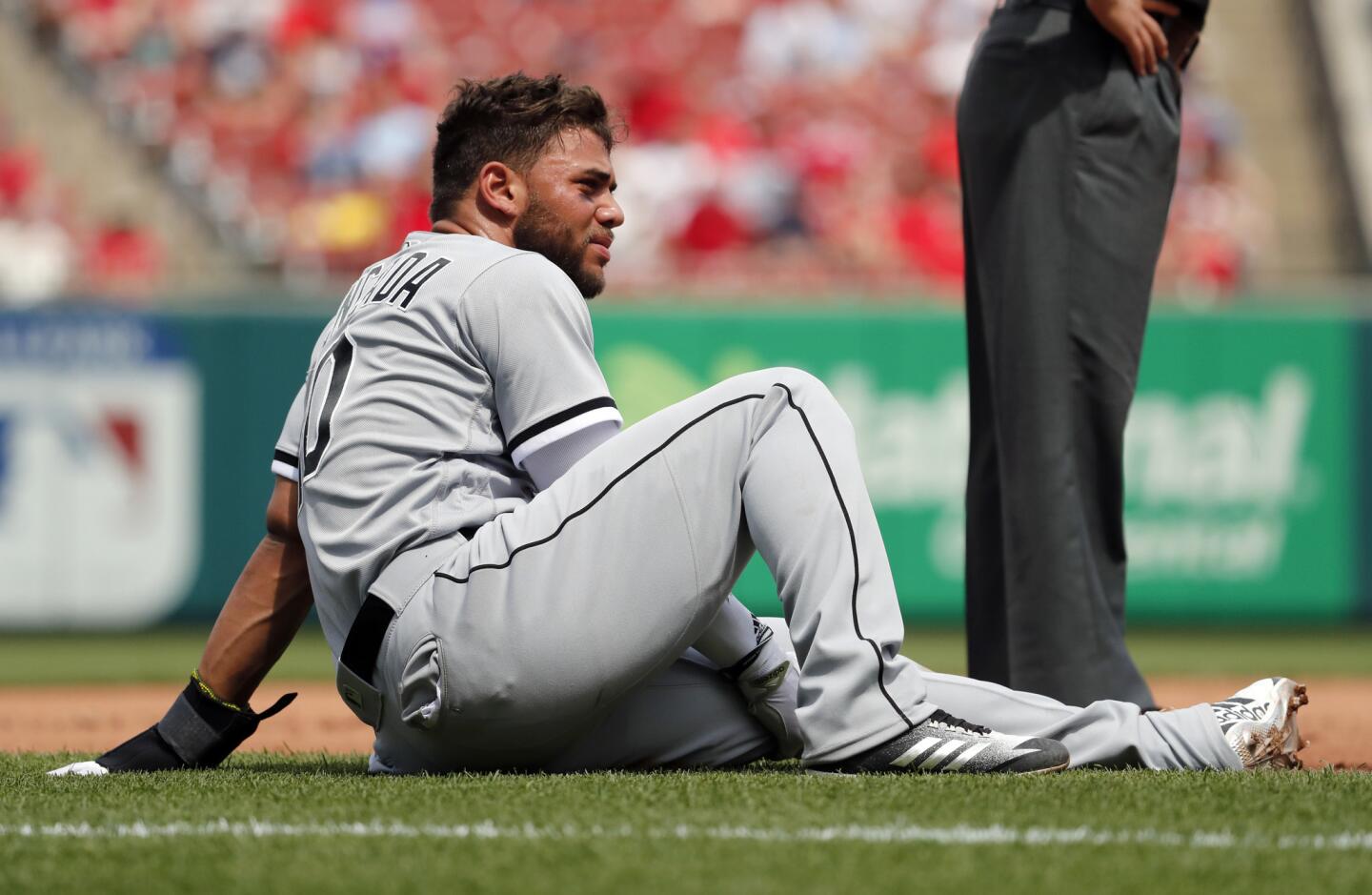 The White Sox's Yoan Moncada holds his leg after sliding into third during the eighth inning against the Cardinals, Wednesday, May 2, 2018, in St. Louis. Moncada left the game and the Cardinals went on to win 3-2.
