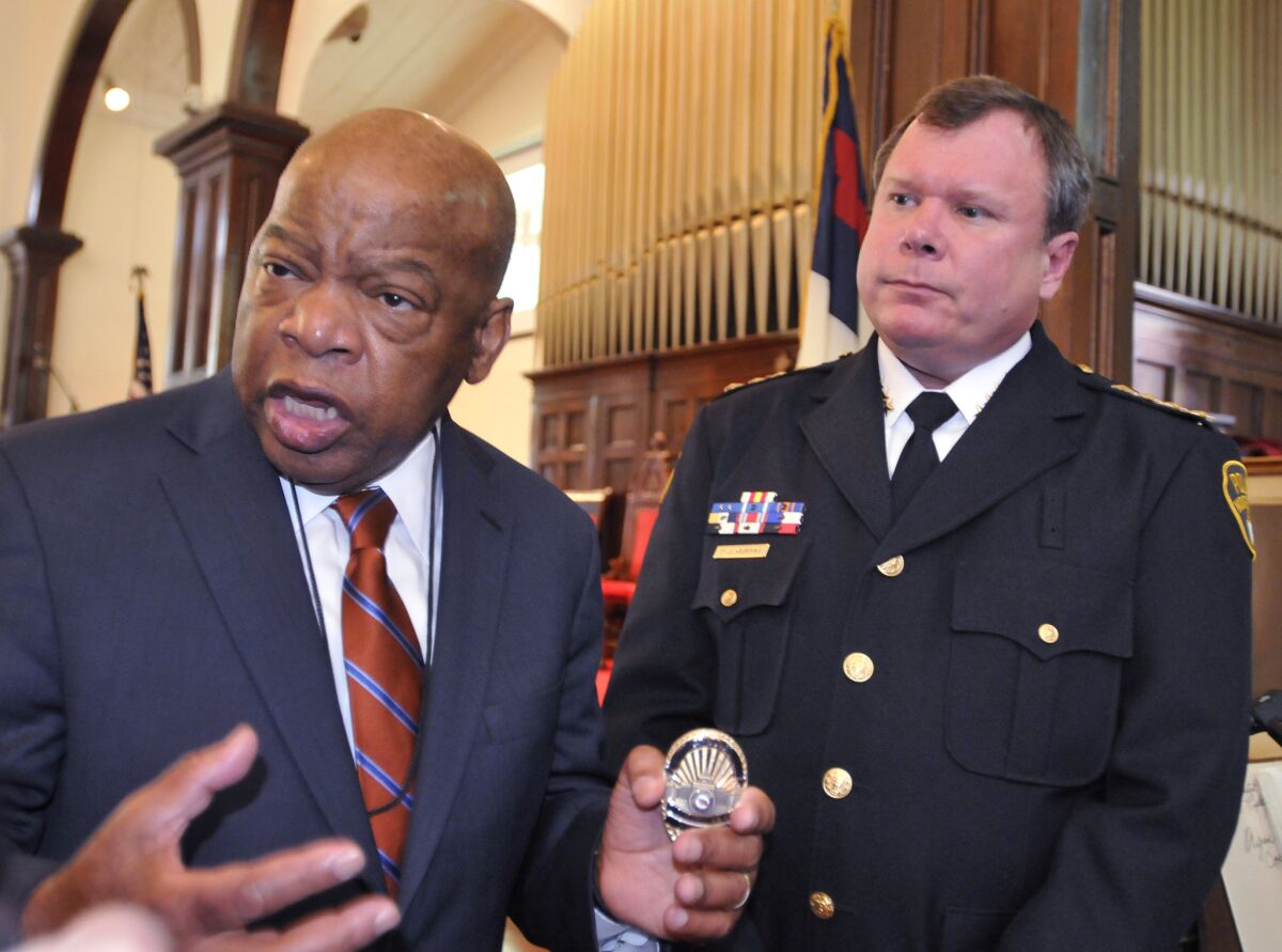 Rep. John Lewis (D-Ga.) with Police Chief Kevin Murphy at the First Baptist Church in Montgomery, Ala., in 2013.
