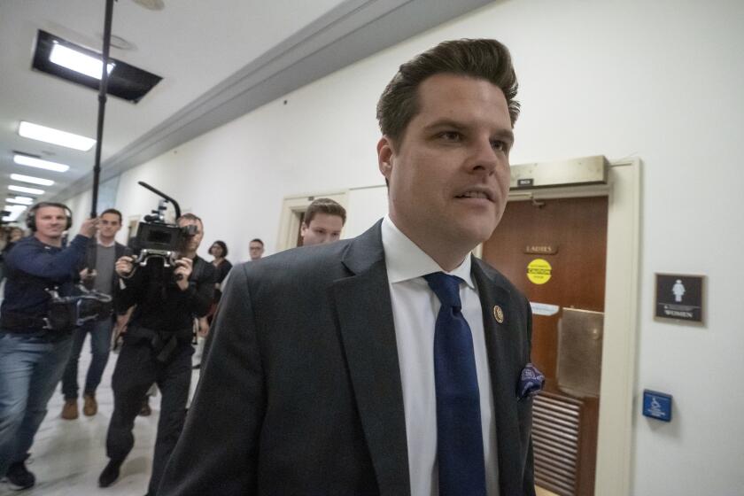 Rep. Matt Gaetz, R-Fla., a member of the House Judiciary Committee, walks past the House Oversight hearing with Michael Cohen, President Donald Trump's former personal lawyer, on Capitol Hill in Washington, Wednesday, Feb. 27, 2019. (AP Photo/J. Scott Applewhite)