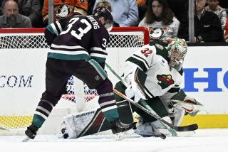 Minnesota Wild goaltender Filip Gustavsson (32) defends against a shot by Anaheim Ducks right wing Jakob Silfverberg (33) during the second period of an NHL hockey game in Anaheim, Calif., Tuesday, March 19, 2024. (AP Photo/Alex Gallardo)