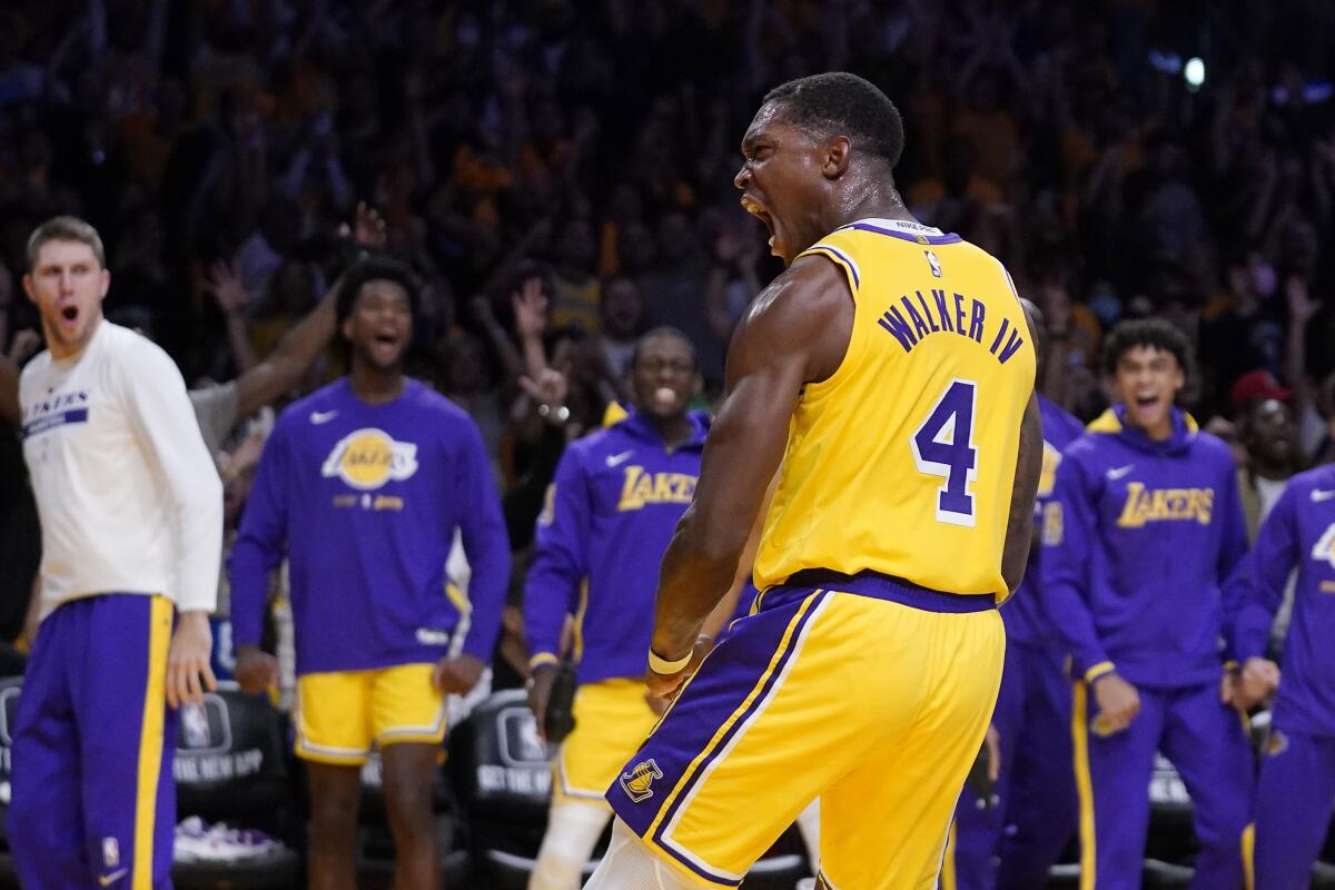 Lakers guard Lonnie Walker IV celebrates after dunking against the Clippers.