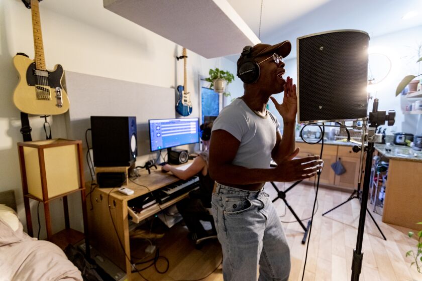 LOS ANGELES, CA - AUGUST 4, 2022: Singer Kelechi Kalu of West Hollywood rehearses his music in a back house rehearsal space on August 4, 2022 in Los Angeles, California. He prefers rehearsing in a private space for fear of monkeypox.(Gina Ferazzi / Los Angeles Times)