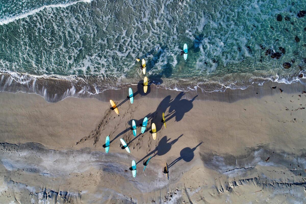 A surfing class on the Lofoten islands in northern Norway.