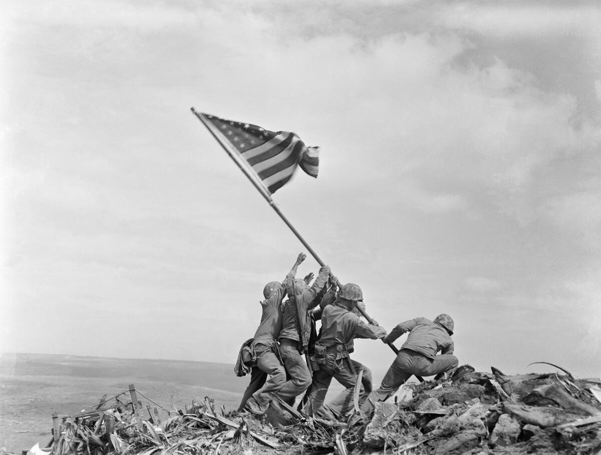 Joe Rosenthal's famous flag-raising image, shot at Iwo Jima in 1945, was later theorized as being staged. It was not.