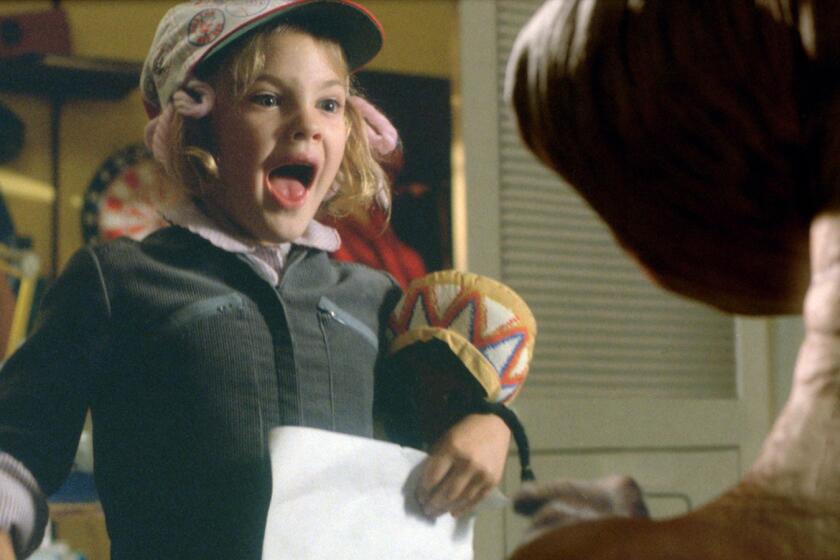 Gertie (DREW BARRYMORE) gets her first look at E.T. The movie E.T. THE EXTRATERRESTRIAL is celebrating its 20th Year Anniversary. photo by ILM. ©2002 Universal Studios and Amblin Entertainment. CURRENT MOVIE SKED RELEASE MARCH 22