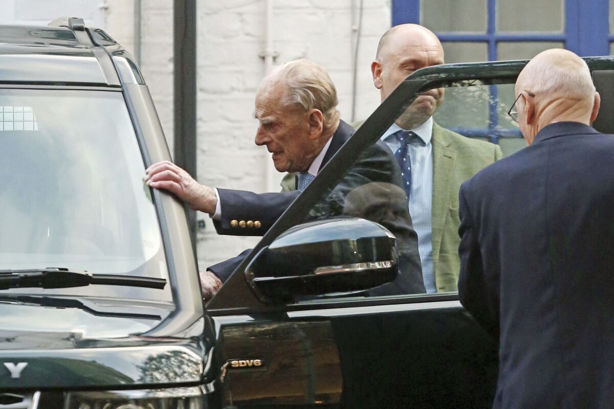 Prince Philip gets in a vehicle after leaving King Edward VII Hospital in London on Tuesday.
