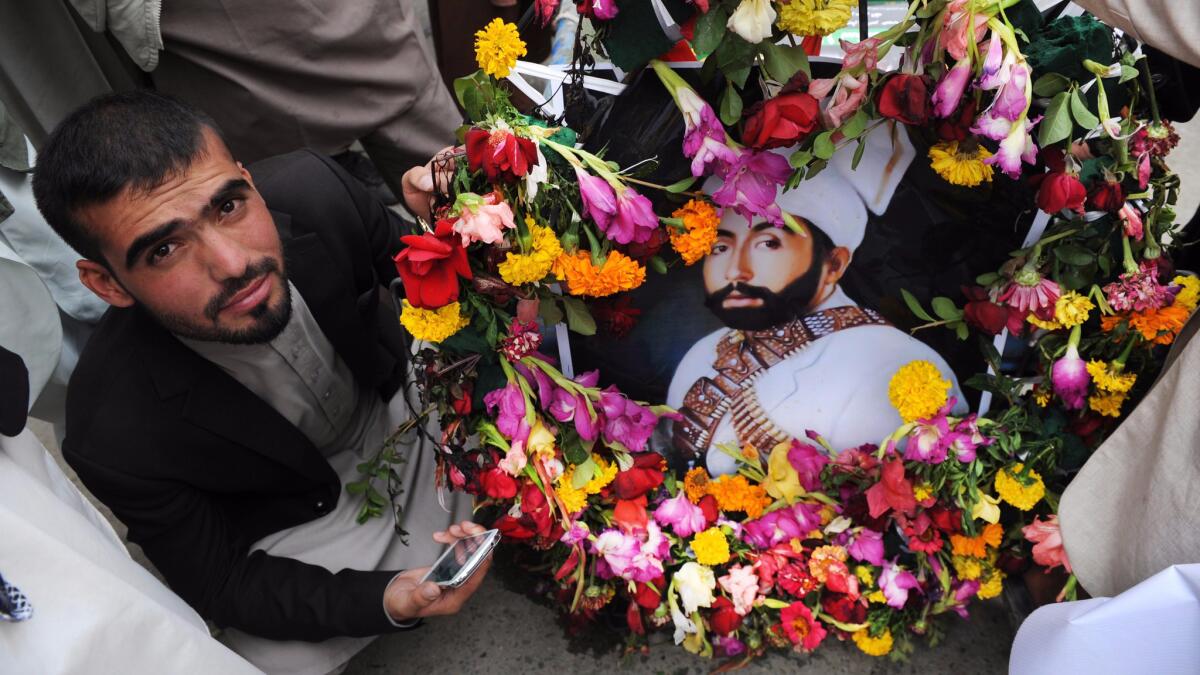 A supporter of former Afghan King Habibullah Kalakani during a re-burial ceremony in Kabul, Afghanistan, on Sept. 1, 2016.